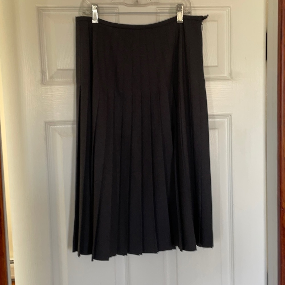 Pleated knee length skirt.